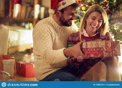 Christmas Holiday Cheerful Couple With T Enjoying On Christ Stock
