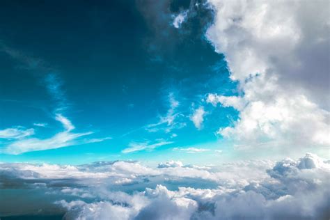 Blue Sky Clouds Flying Hd Wallpaper Over The Clouds Sky 4k