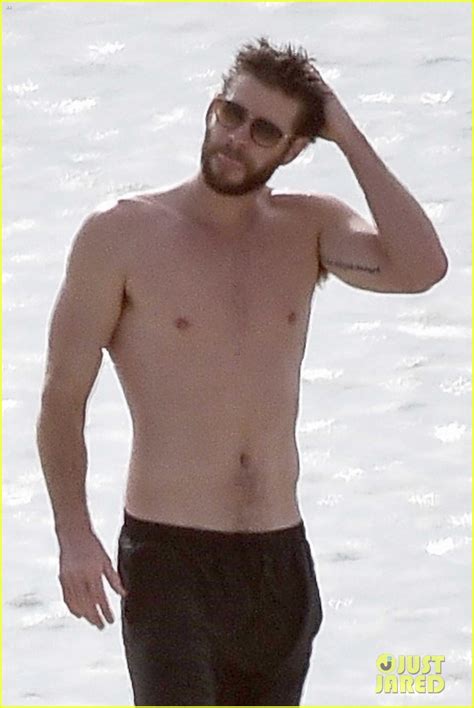 Liam Hemsworth Goes Shirtless On The Beach Where He Met Miley Cyrus Photo Liam