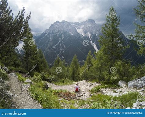 Young Woman Looking On Mountains In Front Of Her Alps Italy