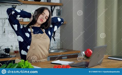 Tired Woman In Kitchen Stretches Tense Muscles After Long Time Online