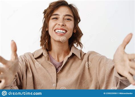 Close Up Portrait Of Happy Young Woman Reaching Her Arms Forward