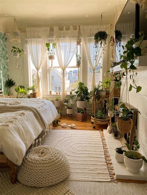 A Bed Room With A Neatly Made Bed And Lots Of Plants On The Windowsill