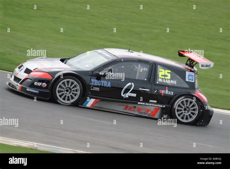 Renault Megane Racing Car Speeding Around A Race Track In The Uk Stock