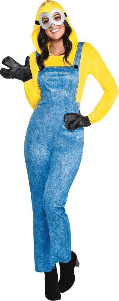 A Woman Dressed As A Minion In Overalls And A Yellow Shirt With Black Gloves