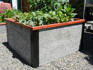 Each board slides into the corner posts. 4'x4'x2' Tall Raised Garden Bed Kit by Durable GreenBed
