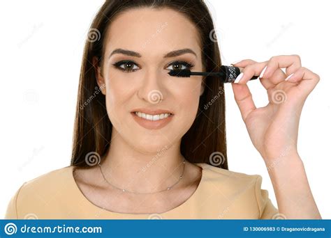 Woman Applying Black Mascara On Eyelashes With Makeup Brush Stock Image