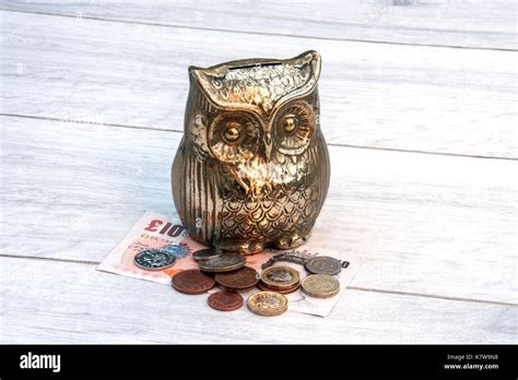 Owl Money Box With Uk Sterling Money Stock Photo Alamy