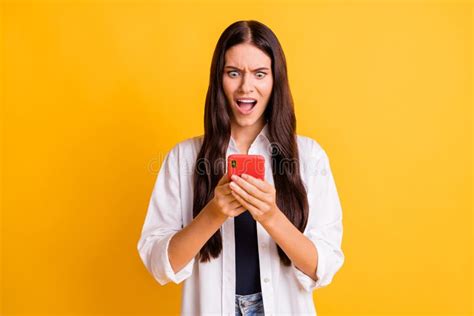 Portrait Of Impressed Pretty Person Staring Phone Open Mouth Bad Fake News Isolated On Yellow