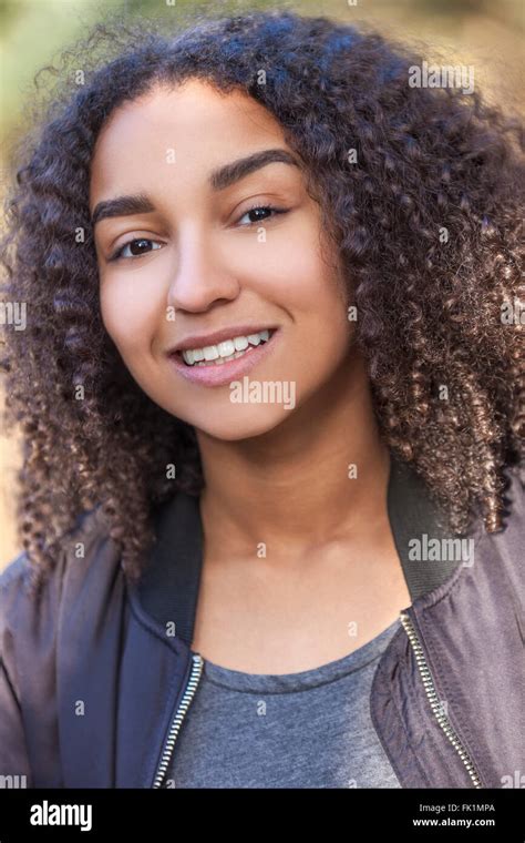 Outdoor Portrait Of Beautiful Happy Mixed Race African American Girl Teenager Female Young Woman