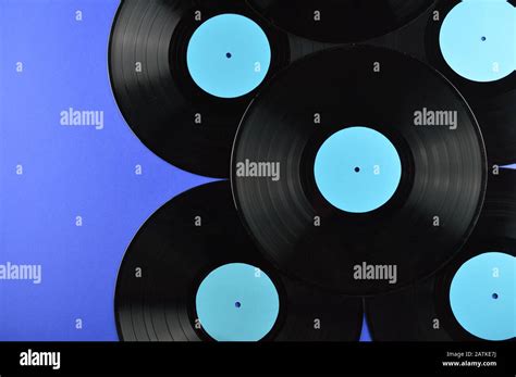 Border Of Old Black Vinyl Records With Blank Cyan Labels On Blue