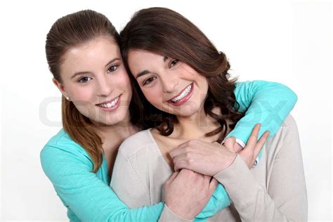 Two Young Women In A Friendly Hug Stock Image Colourbox