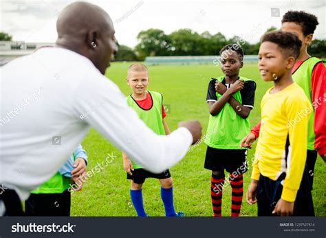 Football Coach Instructing His Students Stock Photo 1237527814