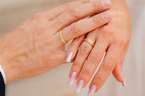 Close Up Hands Of A Groom And A Bride With Rings Stock Image Image
