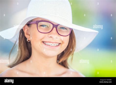 Happy Smiling Girl With Dental Braces And Glasses Orthodontist And