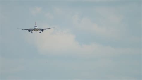 Front View Of Apassenger Aircraft Descending For Landing Jet Plane