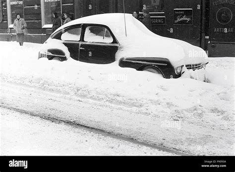 Winter Driving In The 1950s Snow Has Fallen Heavily And The Car Parked