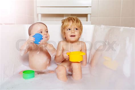 Brother And Sister Babies Play In The Bathroom Stock Image Colourbox