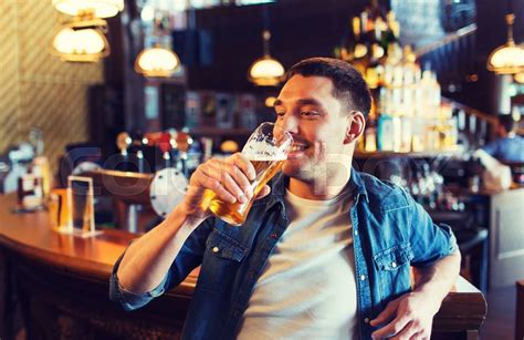 Happy Man Drinking Beer At Bar Or Pub Stock Image Colourbox