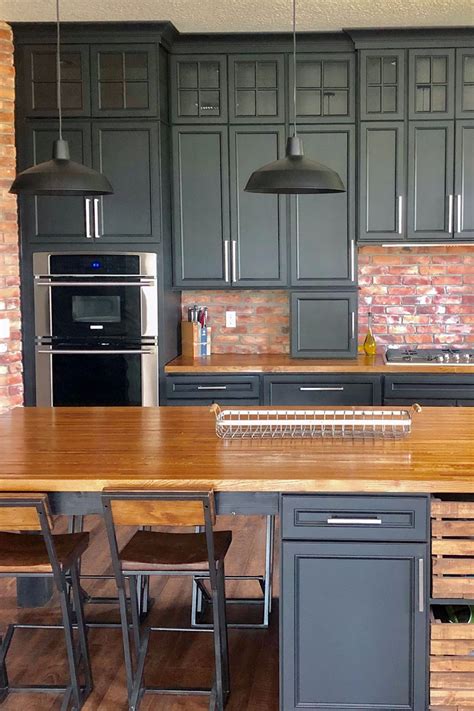 Your cabinet doors and drawer fronts are built to the exact measurements and specifications of your project. The mullion glass stacked cabinets in this rustic Florida kitchen bring light in and balance out ...