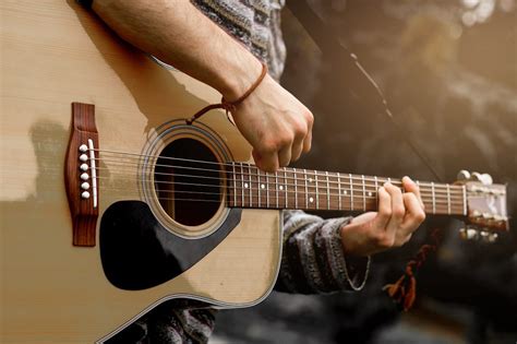 Young Musician Playing Acoustic Guitar Close Up Unpacked