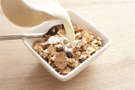 Pouring Milk Into Cereal Free Stock Image