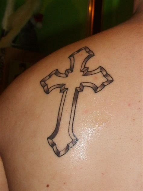 Here is another unique tattoo of a cross that seems to be inspired by the shield of the warrior. Cross Tattoos Shoulder Blade Images & Pictures Becuo ...