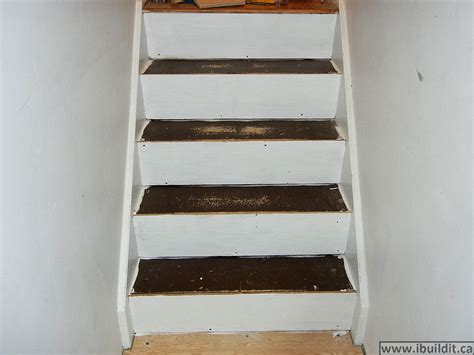 The landing is a concrete pad that was poured on the basement floor slab for the wooden steps to rest on. How To Cover Basement Stairs - IBUILDIT.CA