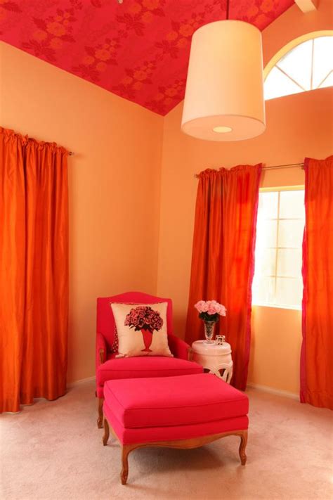 bright transitional sitting area features hot pink chair