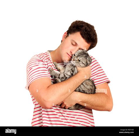 a guy holding a british cat in his arms and hugging her emotional man isolated on white