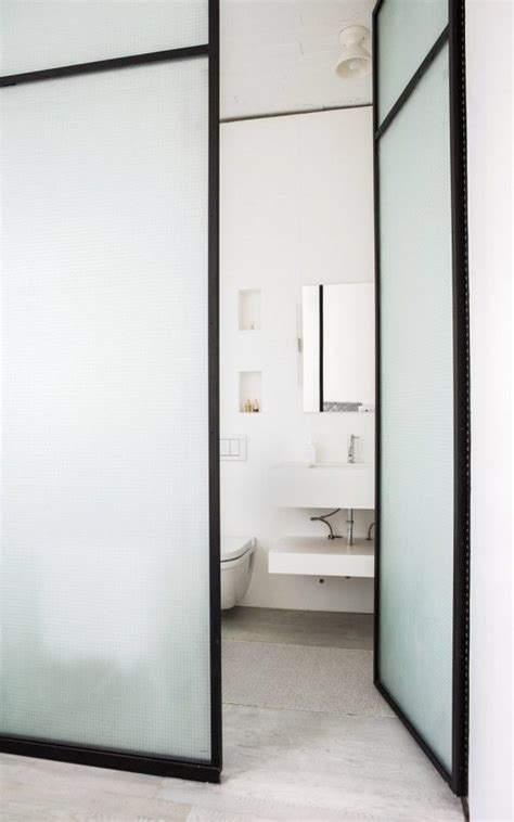 This bathroom has not only two vanities, but the bath is also present right in the bedroom. Pin by Anna Burke on Bathroom | Glass bathroom door, Glass ...