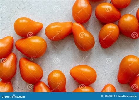 Small Orange Tomatoes On A Grey Table Stock Image Image Of Supper