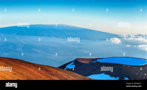 View Across Cinder Cone On Mauna Kea To Mauna Loa Summit In Snow On