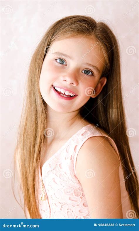 Portrait Of Adorable Smiling Happy Little Girl Child Stock Photo