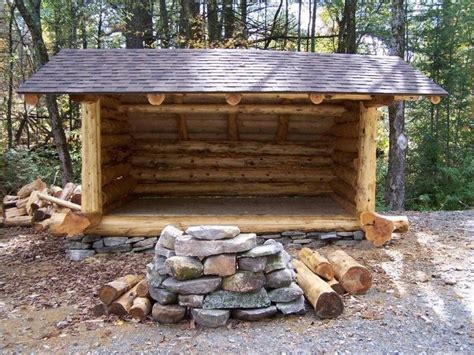 A Log Cabin In The Woods With Logs Stacked Around Its Base And Roof
