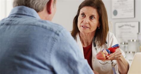 Doctor Talking To Elderly Patient About Heart Stock Image Image Of