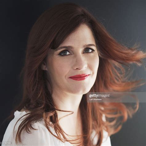 Portrait Of Red Headed Woman With Hair Blowing Photo Getty Images