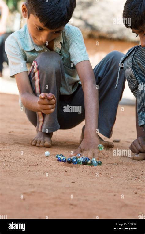 Indian Boys Playing Marbles In A Rural Indian Village Andhra Stock