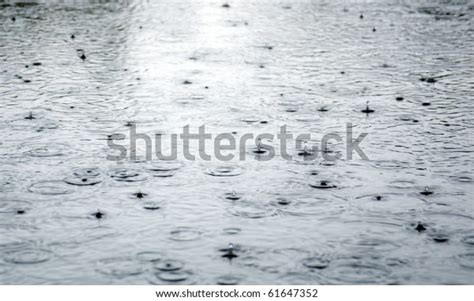 Rain Drops Rippling Puddle Closeup Stock Photo Edit Now 61647352