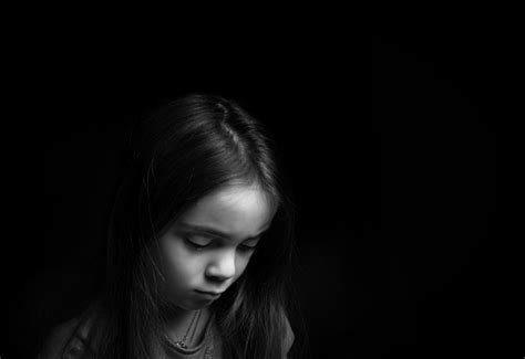 ❤ get the best sad background on wallpaperset. Sad Looking Girl In Front Of Black Background Stock Photo ...