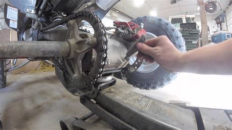 As for how much slack the chain needs every bike will have a different amount of free play so consult your owners' manual to find out what's right for your once your chain is clean and adjusted you can then apply the lubricating grease, use recognised motorcycle chain grease as they have application. How to adjust the chain slack on a YFZ450 - YouTube