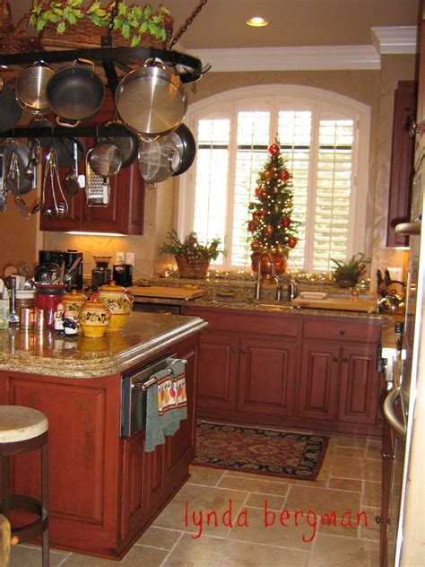 Red kitchen cabinets with a light black glaze, this kitchen features a eight foot island made out of reclaimed oak from an old factory, under counter … LYNDA BERGMAN DECORATIVE ARTISAN: HAND PAINTED RED KITCHEN ...