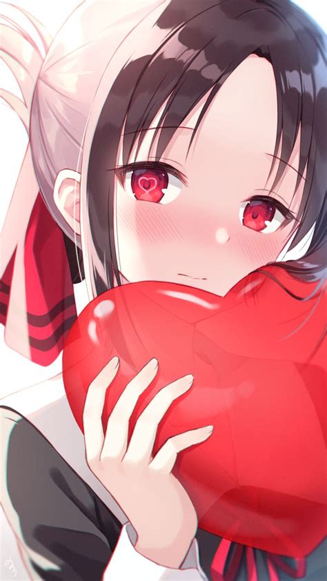 An Anime Girl Holding A Heart In Her Hands