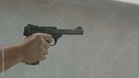 Shooter Slowly And Securely Firing Two Shots And Placing His Finger Above The Trigger V Deo De