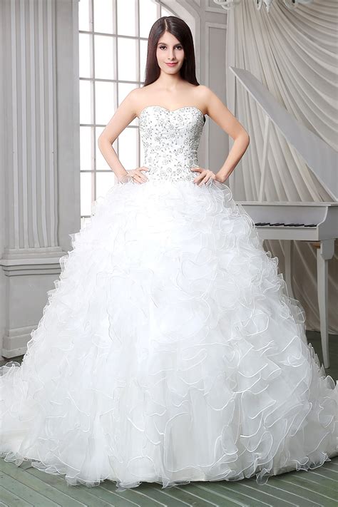 A classic ballgown silhouette gets a modern, romantic revival in this spectacular unembellished satin wedding dress. Royal Ball Gown Strapless Satin Embroidery Organza Ruffle ...