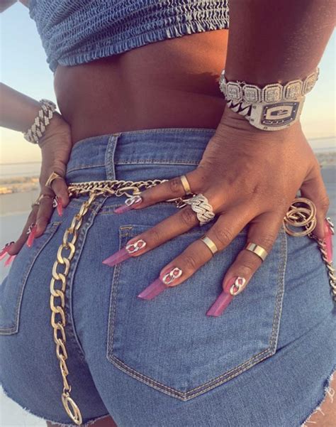 The look was paired with french tip nail art with graphic blue details, created by nail artist @cocamichelle. Meg Thee Stallion nail inspo in 2020 | Lipstick nails ...