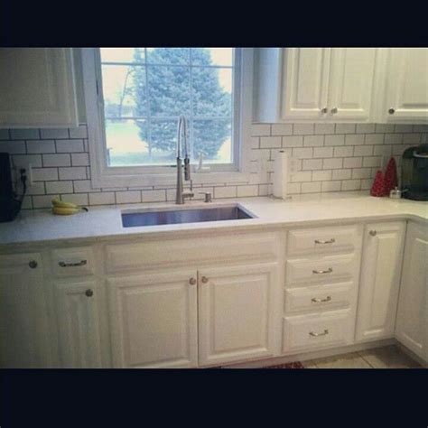 Gray kitchen walls maple cabinets. White subway tile with grey grout and maple cabinets ...