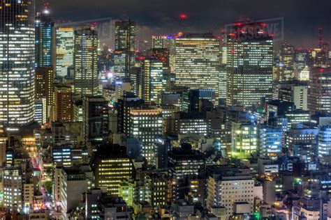 Since then he has spent a few years capturing the streets of tokyo at night, the results now published in his first photography book, to:ky:oo. Downtown city buildings at night, Tokyo, Japan, Asia - Stock Photo - Dissolve