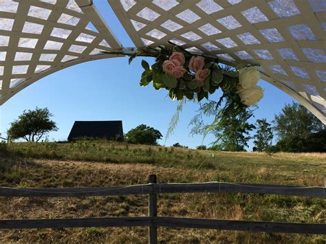 Ceremony Arch In The Corral With Flowers From Derby Farm Flowers