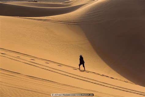 Photo Of Girl Walking On Sand Dunes Rub Al Khali Desert Sand Dunes